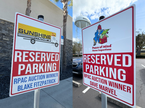 Reserved parking signs for RPAC auction winners Blake Fitzpatrick of Sunshine Movers and Dave Marvel of Peace of Mind Home Inspections.