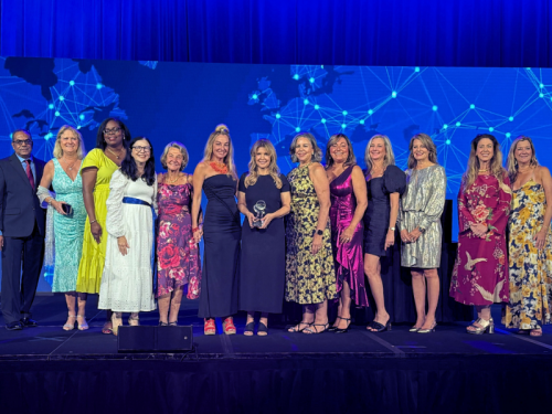 GBC Standing on Florida Realtors® Stage Holding Award